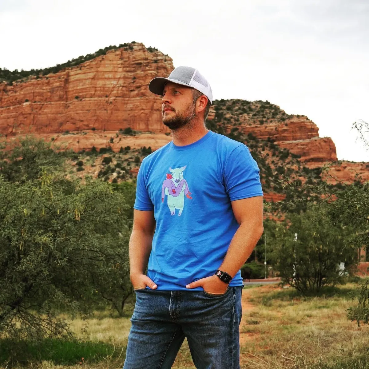 Dustin Coressel standing in front of Sedona's red rock cliffs