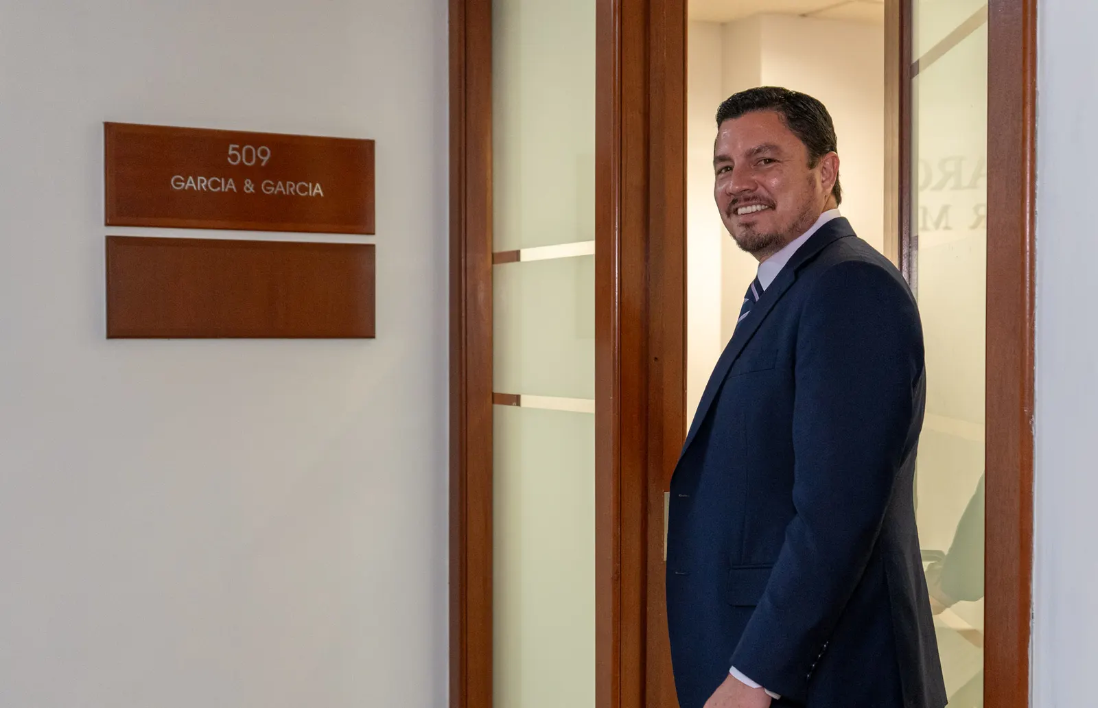 Garcia & Garcia attorney at the firm's suite door