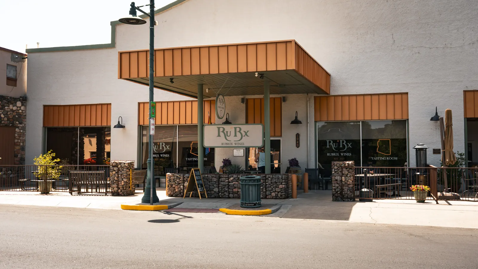 Ru°Bx Winery storefront with copper awnings and patio seating